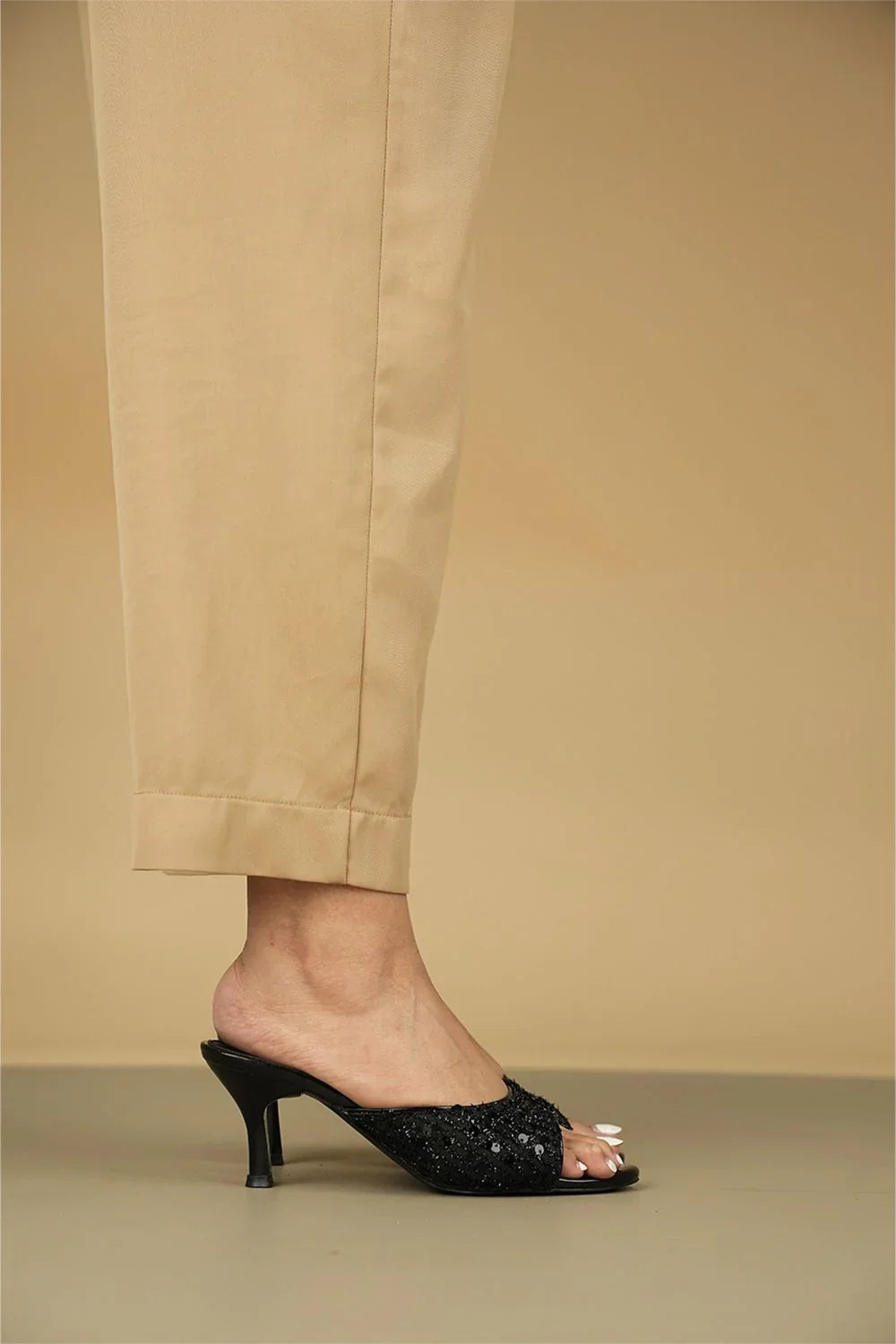 OPIA 9792 BLACK sequined black slip-on heels with mid-height heel, worn with beige pants